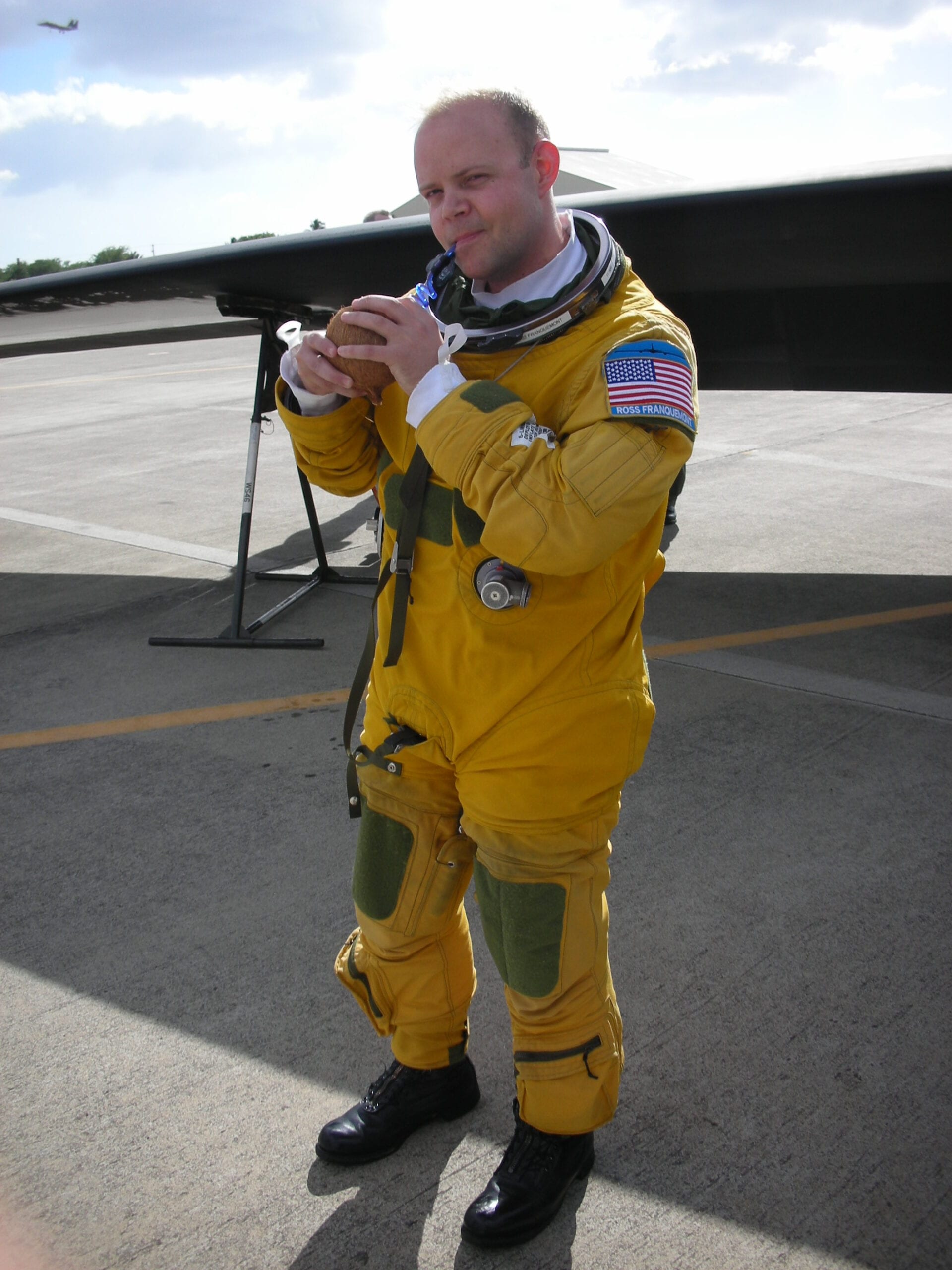 extreme ross sips on a coconut beverage after landing in Hawaii